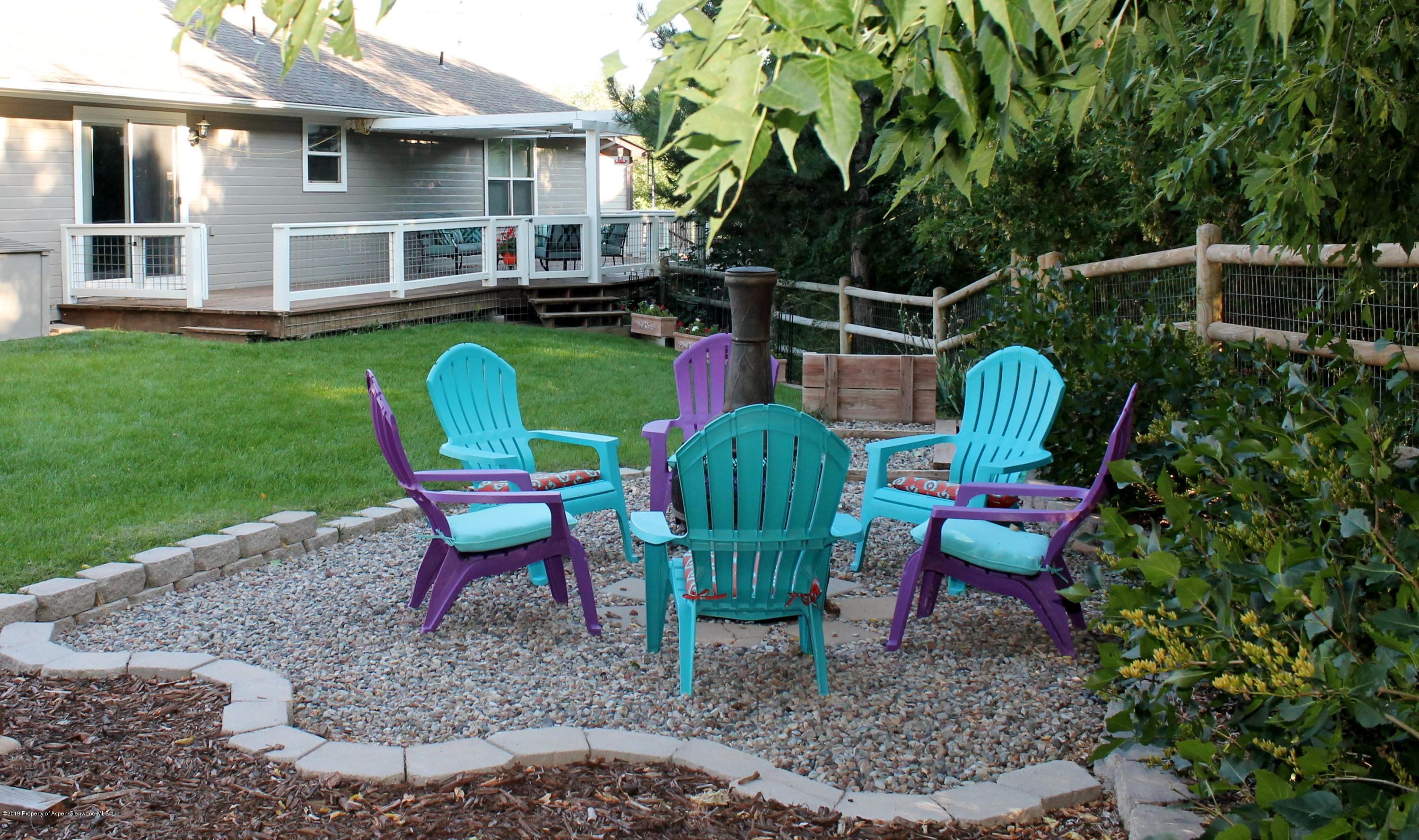 695 Birch Court Rifle, CO 81650 - Photo 39 of 46 a view of a backyard with furniture and garden