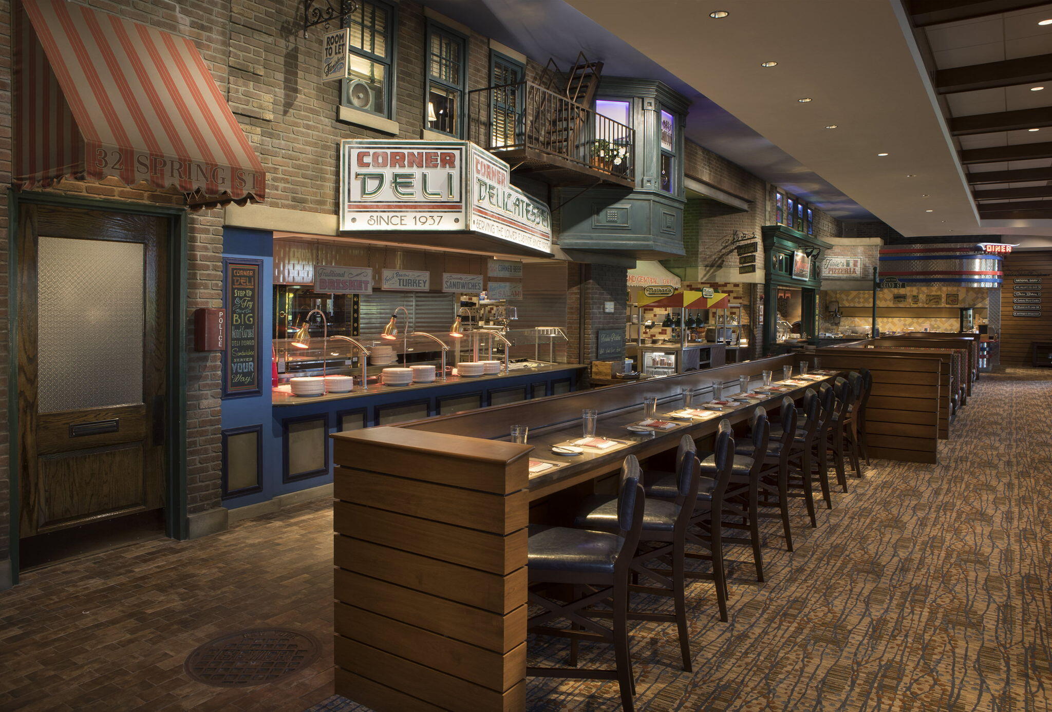 6895 Willow Wood Drive, Unit 1083 Boca Raton, FL 33434 - Photo 33 of 56 a kitchen with stainless steel appliances granite countertop a table and chairs