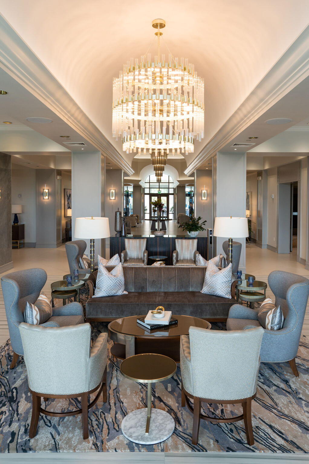 6895 Willow Wood Drive, Unit 1083 Boca Raton, FL 33434 - Photo 36 of 56 a living room with furniture a chandelier and a large window