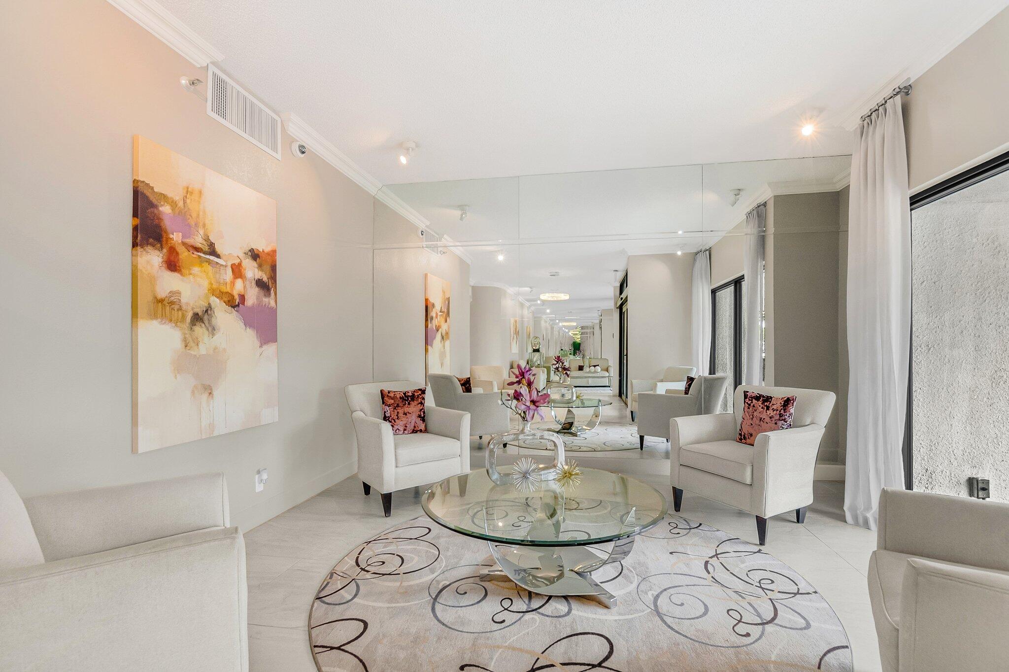 6895 Willow Wood Drive, Unit 1083 Boca Raton, FL 33434 - Photo 4 of 56 a living room with furniture and wooden floor