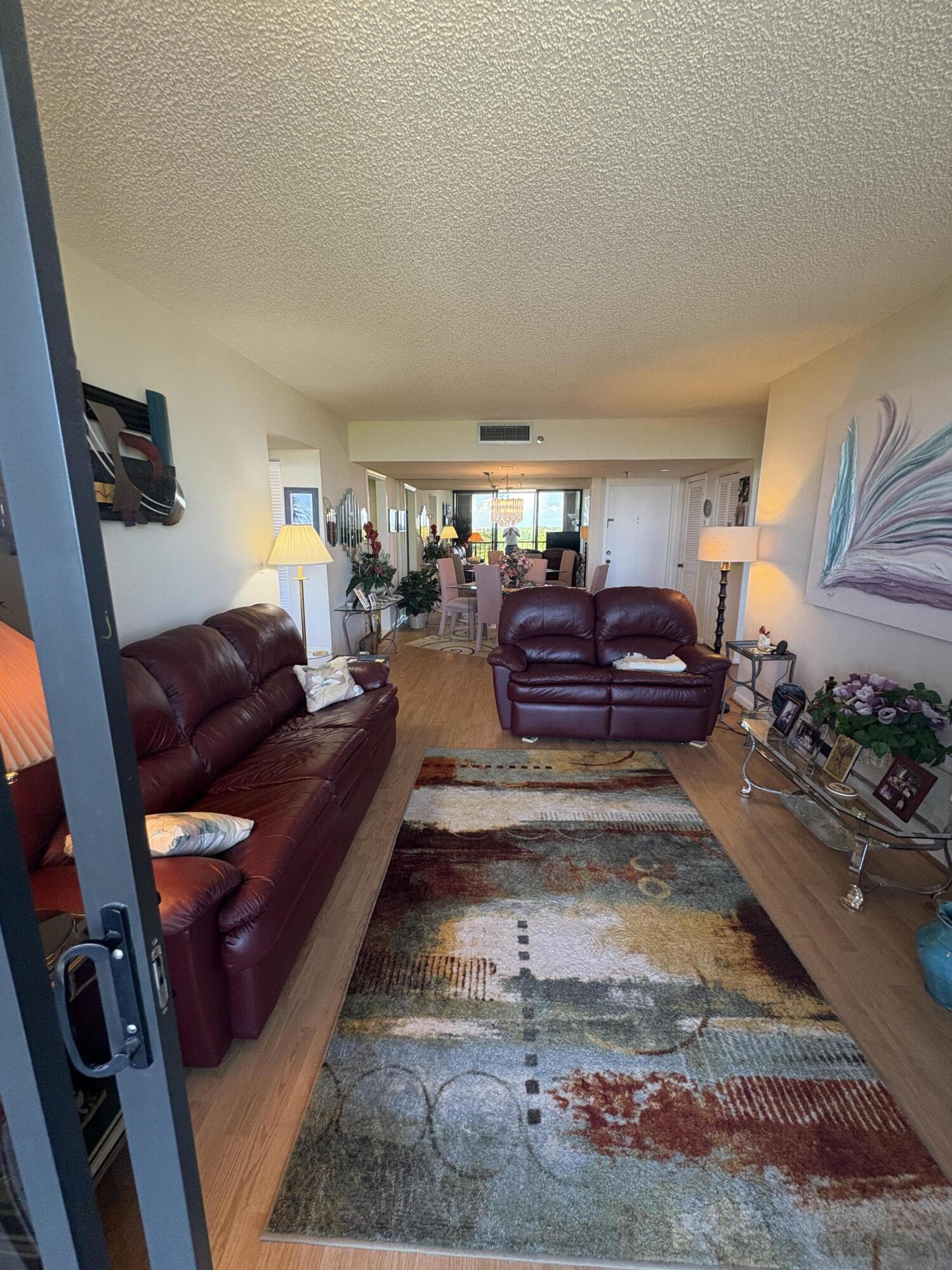 6895 Willow Wood Drive, Unit 1083 Boca Raton, FL 33434 - Photo 9 of 56 a living room with furniture