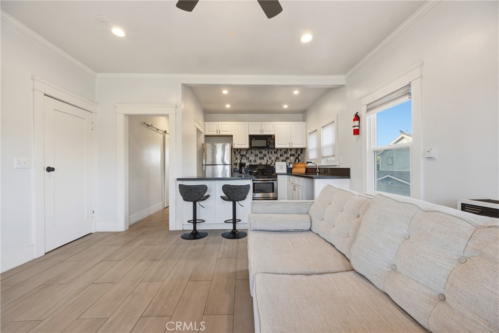 325 East 14th Street Long Beach, CA 90813 - Photo 9 of 21 a living room with furniture and a view of kitchen