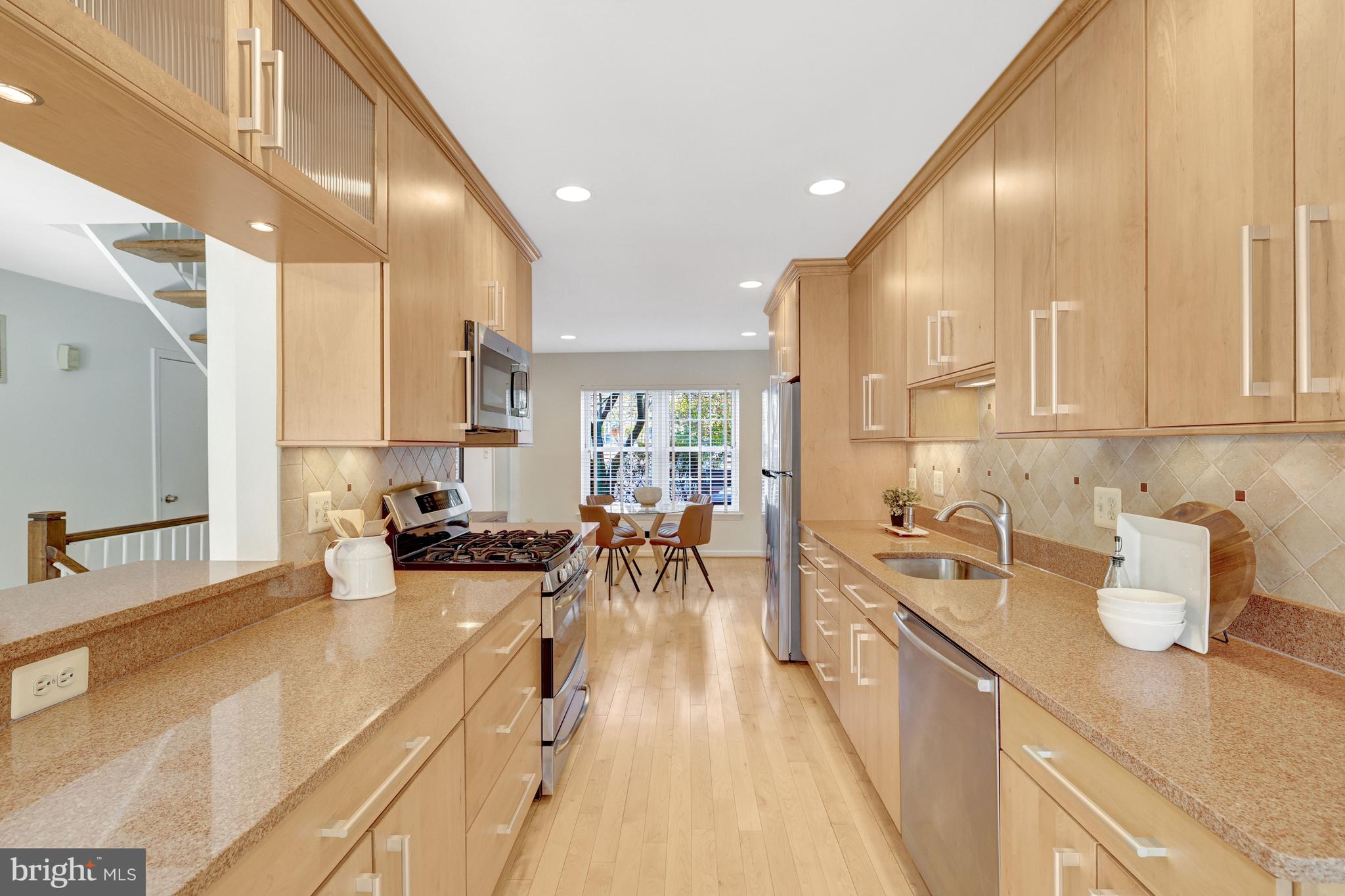 2120 Golf Course Drive Reston, VA 20191 - Photo 17 of 63 Kitchen with raised ledge open to the living room.