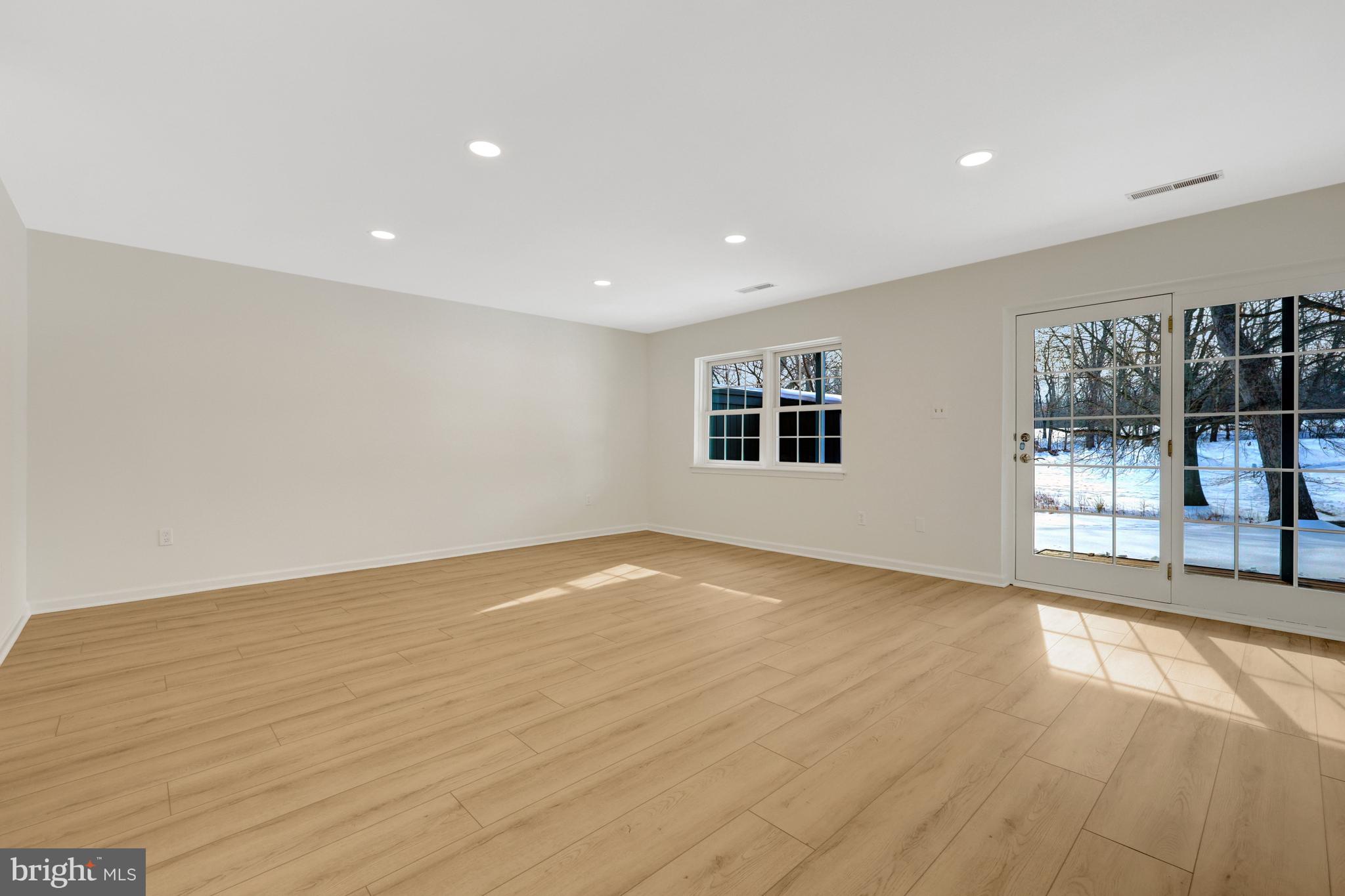 2120 Golf Course Drive Reston, VA 20191 - Photo 38 of 63 The window & glass French door offer great light.
