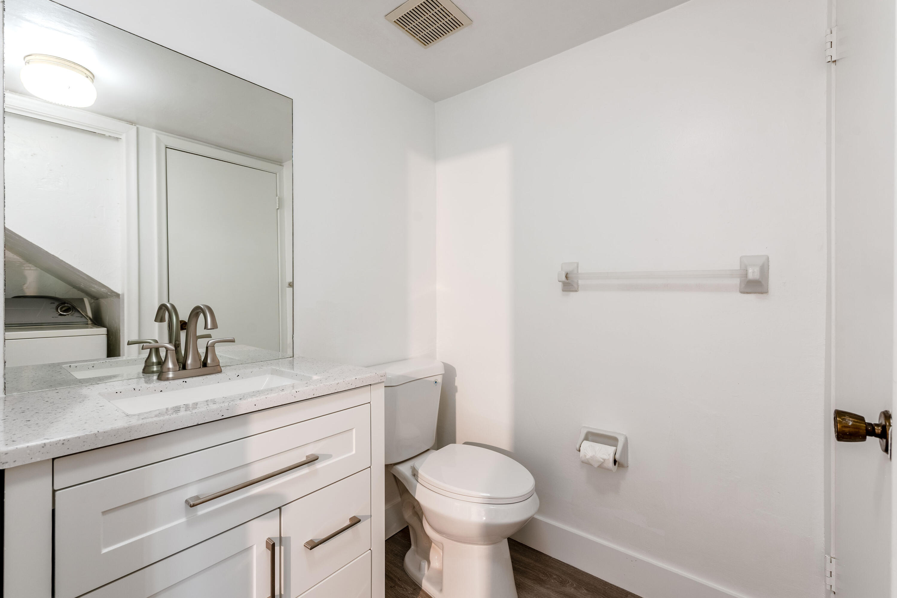 471 Kirk Road, Unit D West Palm Beach, FL 33406 - Photo 12 of 28 a bathroom with a sink toilet and vanity