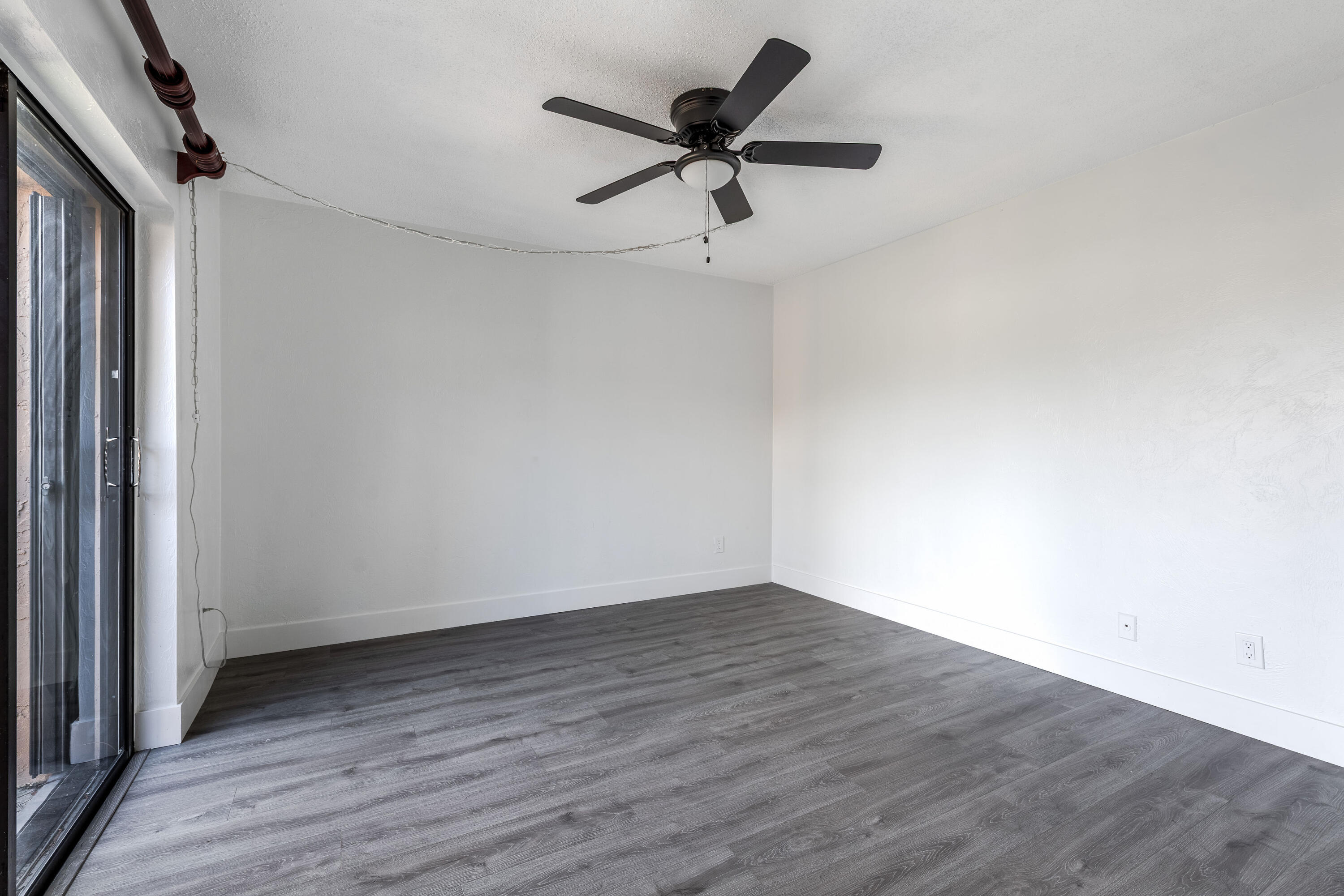 471 Kirk Road, Unit D West Palm Beach, FL 33406 - Photo 13 of 28 wooden floor in an empty room