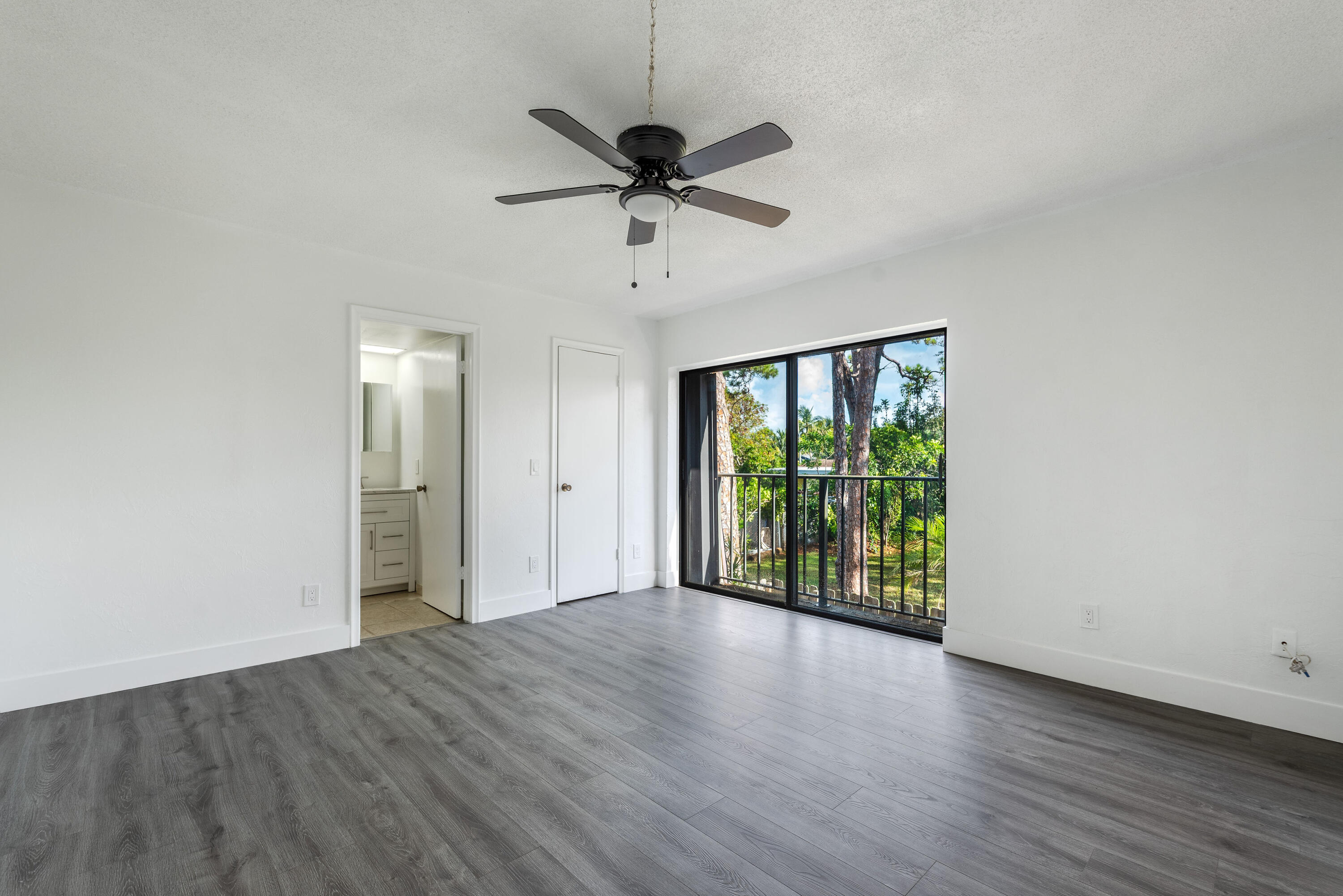 471 Kirk Road, Unit D West Palm Beach, FL 33406 - Photo 17 of 28 a view of an empty room with a window