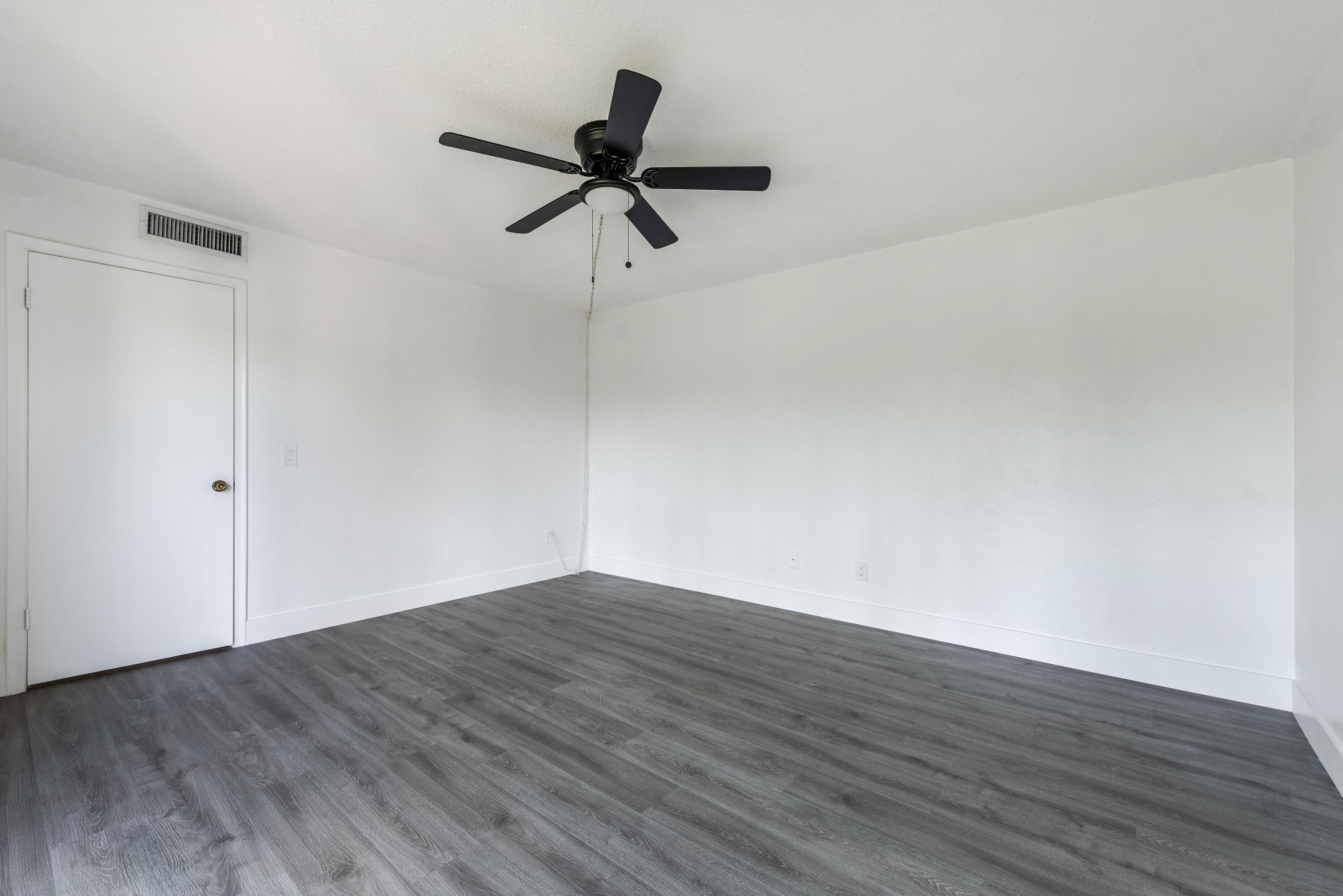 471 Kirk Road, Unit D West Palm Beach, FL 33406 - Photo 19 of 28 wooden floor in an empty room