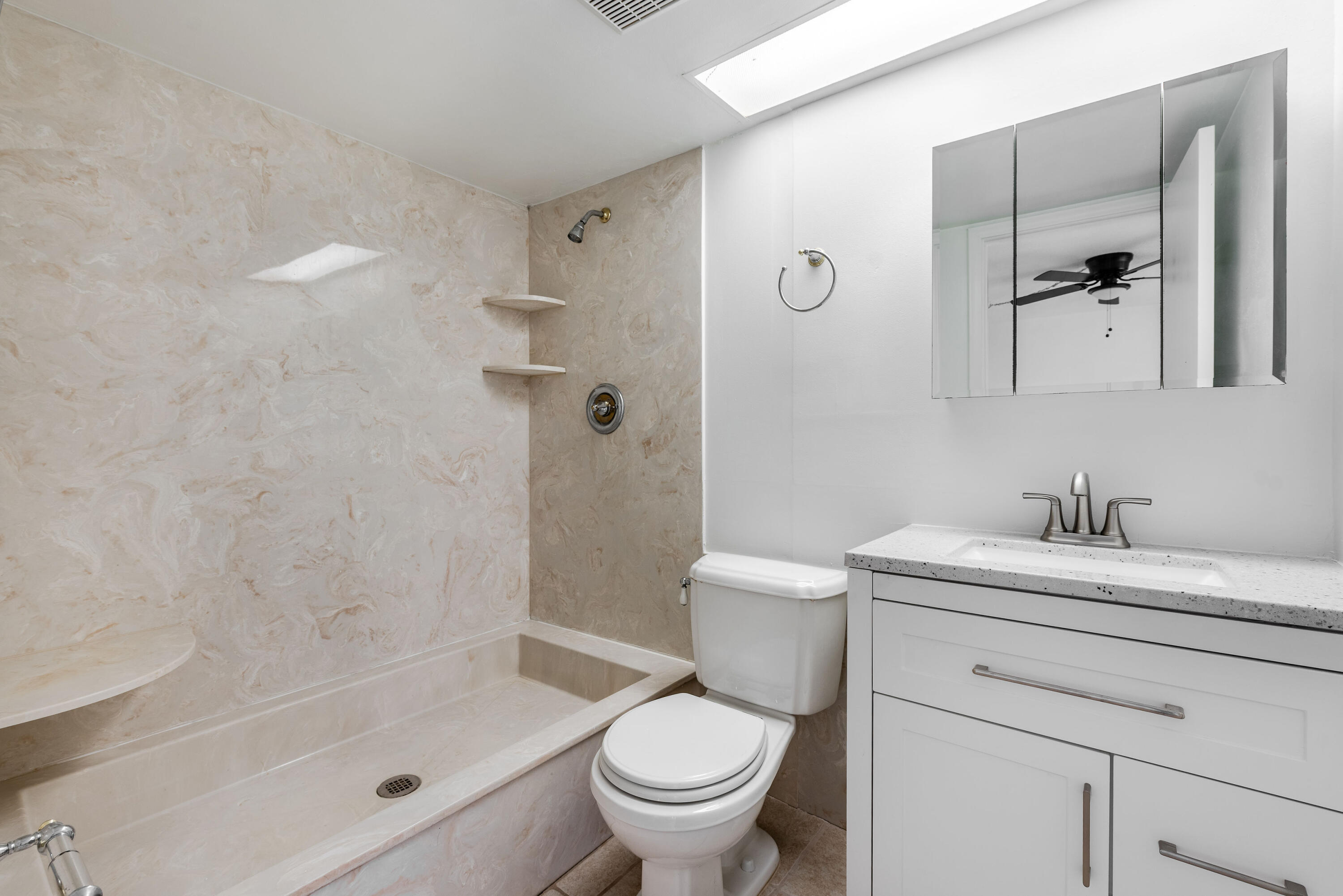 471 Kirk Road, Unit D West Palm Beach, FL 33406 - Photo 21 of 28 a bathroom with a sink a toilet and shower
