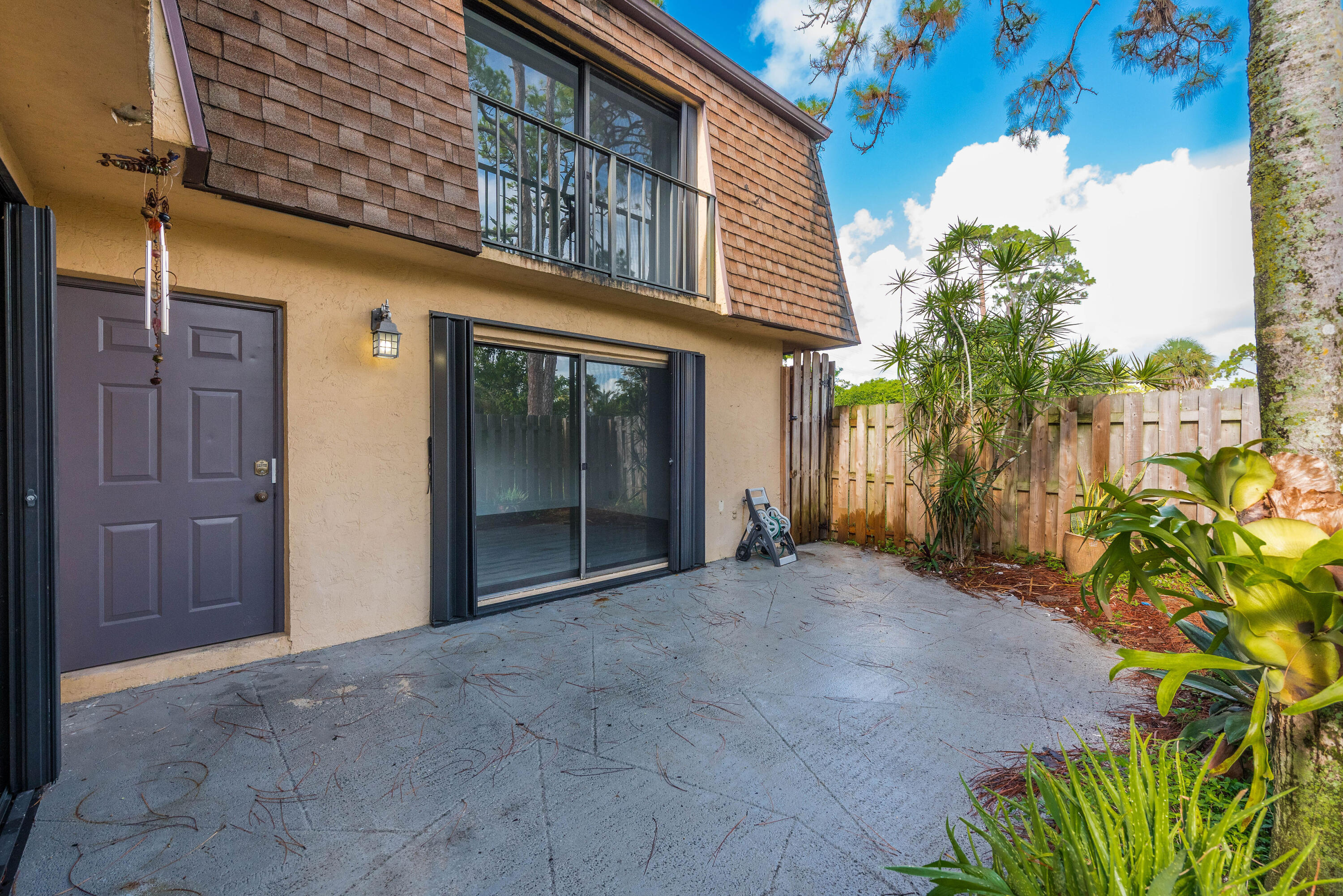 471 Kirk Road, Unit D West Palm Beach, FL 33406 - Photo 24 of 28 a view of a house with a backyard