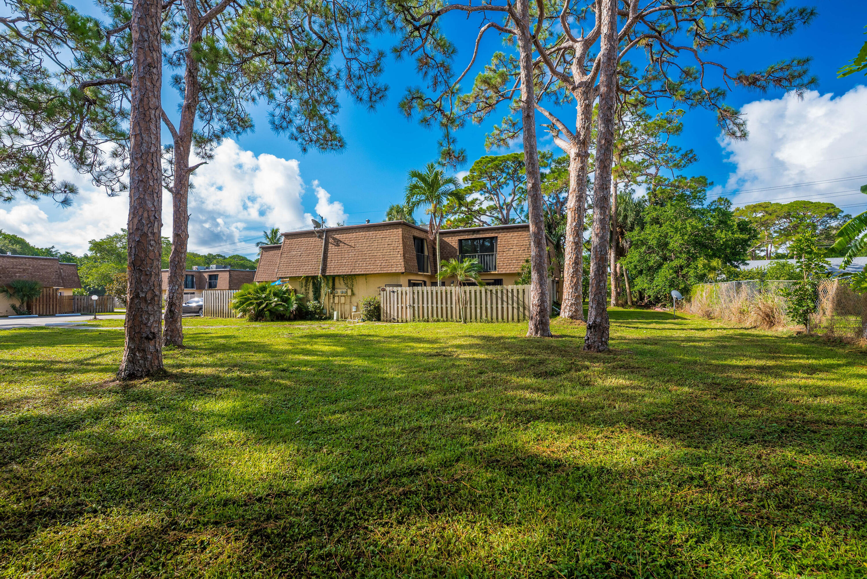 471 Kirk Road, Unit D West Palm Beach, FL 33406 - Photo 27 of 28 a view of a house with a big yard