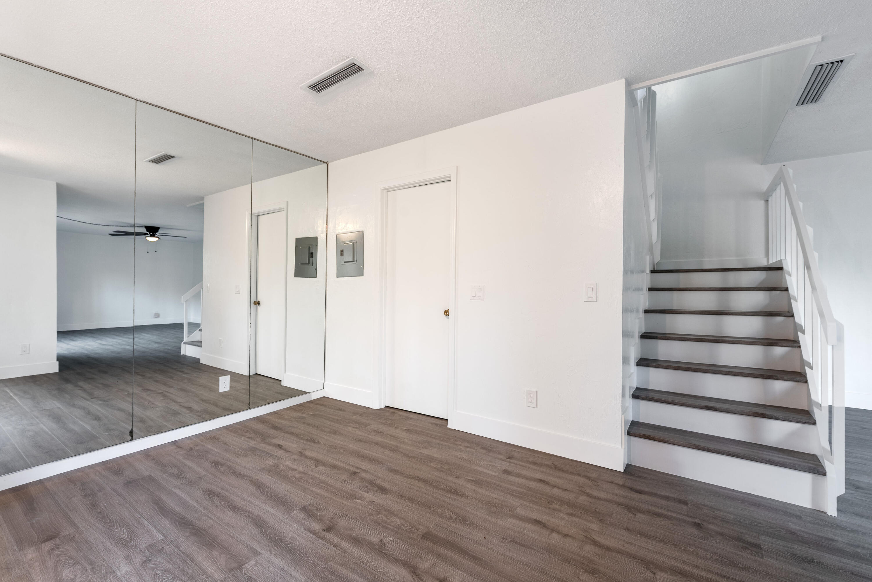471 Kirk Road, Unit D West Palm Beach, FL 33406 - Photo 7 of 28 a view of a hallway with wooden floor and entryway