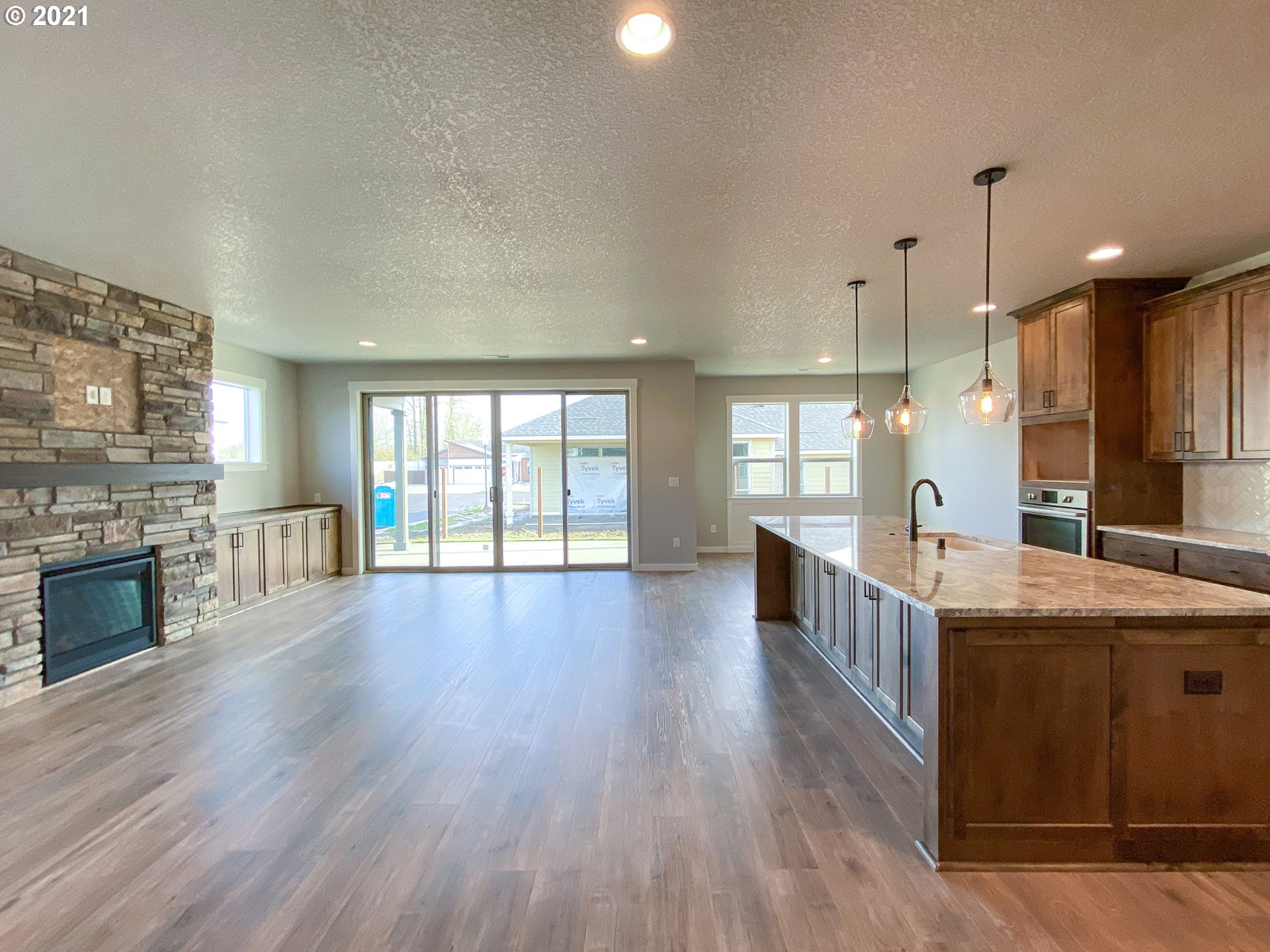 814 South Goose Loop Ridgefield, WA 98642 - Photo 2 of 22 a large kitchen with stainless steel appliances granite countertop a lot of counter space and wooden floors
