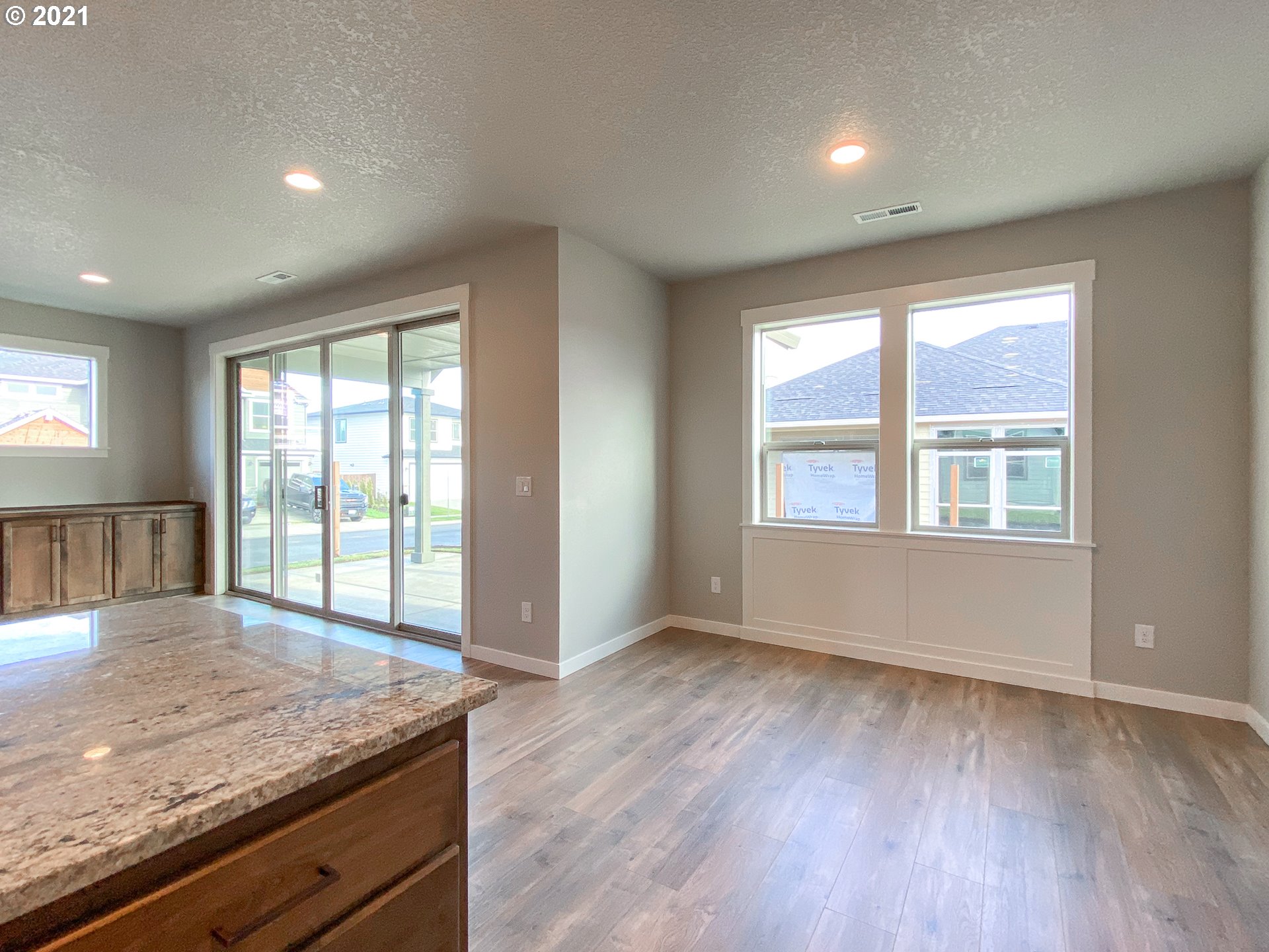 814 South Goose Loop Ridgefield, WA 98642 - Photo 7 of 22 an empty room with wooden floor and windows