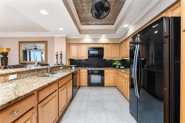 a spacious bathroom with a large mirror vanity and a bathtub