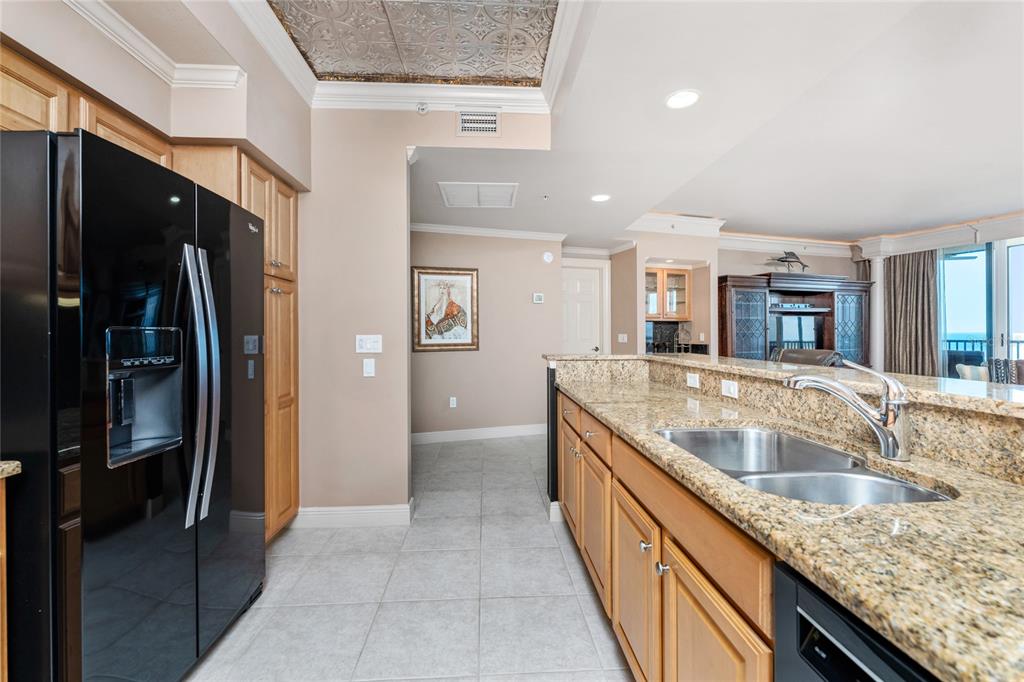 3333 Sunset Key Circle, Unit 506 Punta Gorda, FL 33955 - Photo 19 of 78 a large kitchen with stainless steel appliances granite countertop a refrigerator and a sink