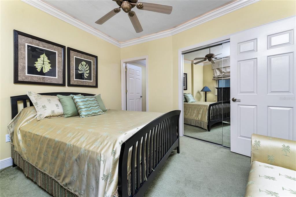3333 Sunset Key Circle, Unit 506 Punta Gorda, FL 33955 - Photo 33 of 78 a bedroom with a bed and a view of bathroom