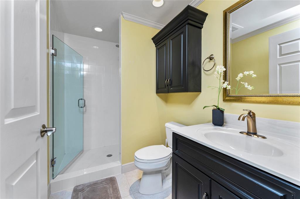 3333 Sunset Key Circle, Unit 506 Punta Gorda, FL 33955 - Photo 34 of 78 a bathroom with a sink a toilet a mirror and shower
