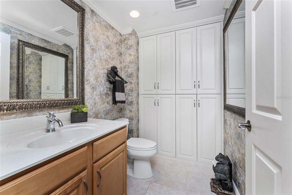 3333 Sunset Key Circle, Unit 506 Punta Gorda, FL 33955 - Photo 36 of 78 a bathroom with a sink a toilet and a mirror