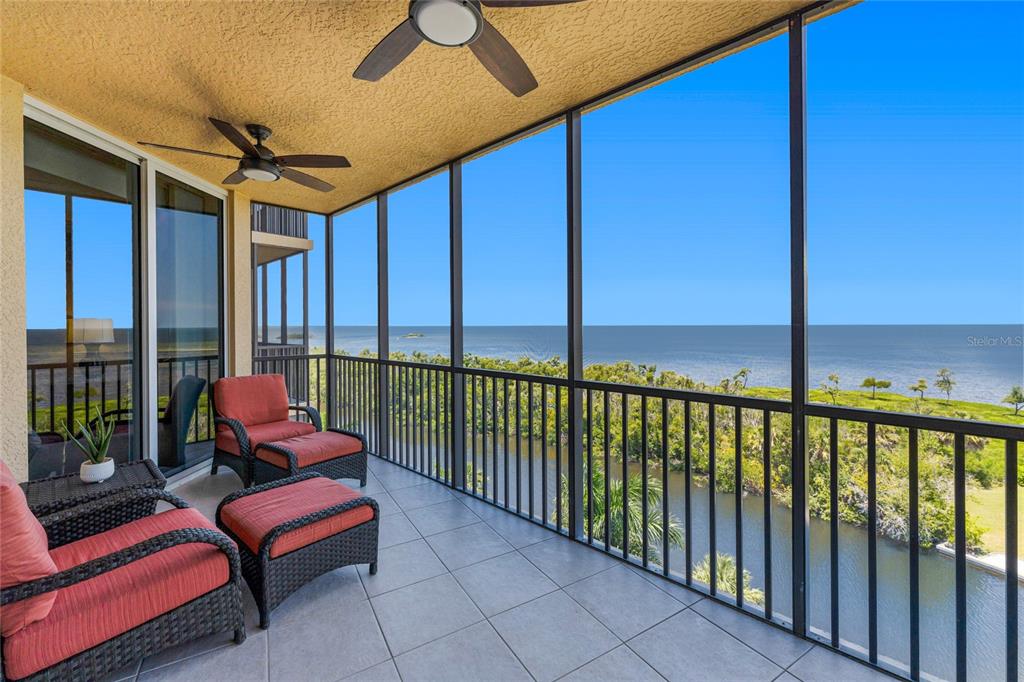 3333 Sunset Key Circle, Unit 506 Punta Gorda, FL 33955 - Photo 4 of 78 a roof deck with a table and chairs