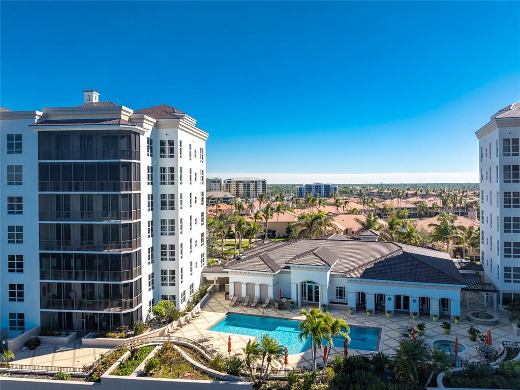 3333 Sunset Key Circle, Unit 506 Punta Gorda, FL 33955 - Photo 43 of 78 a front view of a residential apartment building with a yard