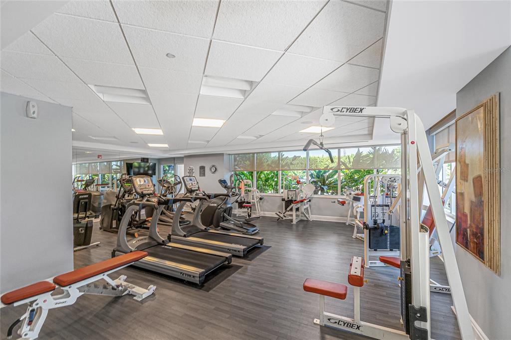 3333 Sunset Key Circle, Unit 506 Punta Gorda, FL 33955 - Photo 61 of 78 a room with lots of gym equipment and a large window