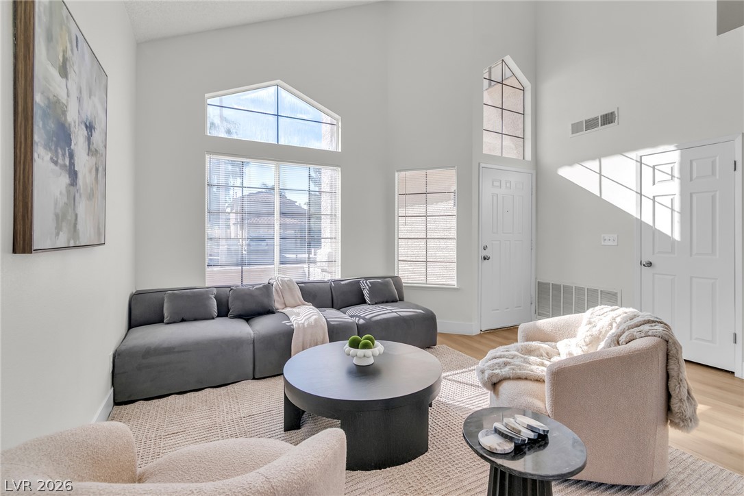 370 Rushing Creek Court Henderson, NV 89014 - Photo 30 of 32 High ceilings and tall windows bring abundant natural light into this welcoming living space.