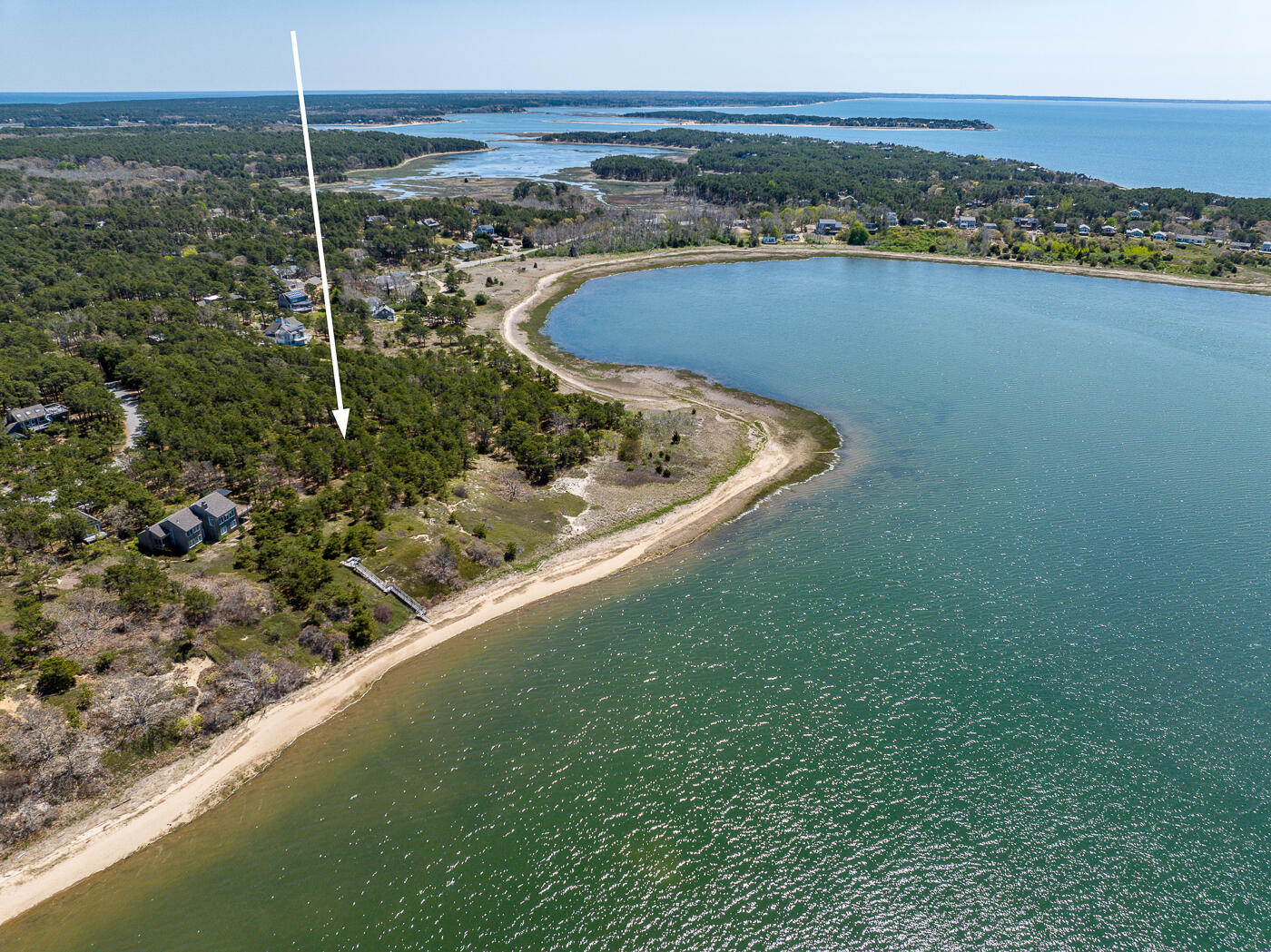 65 Belding Way Wellfleet, MA 02667 - Photo 2 of 8 a view of a lake with a outdoor space