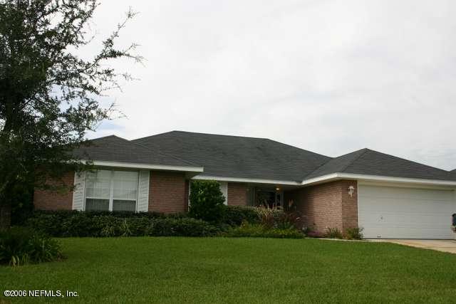 2498 Mallory Hills Road Jacksonville, FL 32221 - Photo 9 of 9 a front view of house with yard and green space