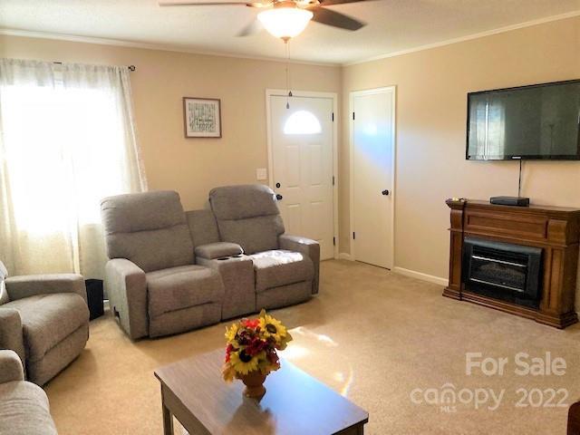 687 Thompson Road Rutherfordton, NC 28139 - Photo 3 of 38 a living room with furniture a flat screen tv and a window