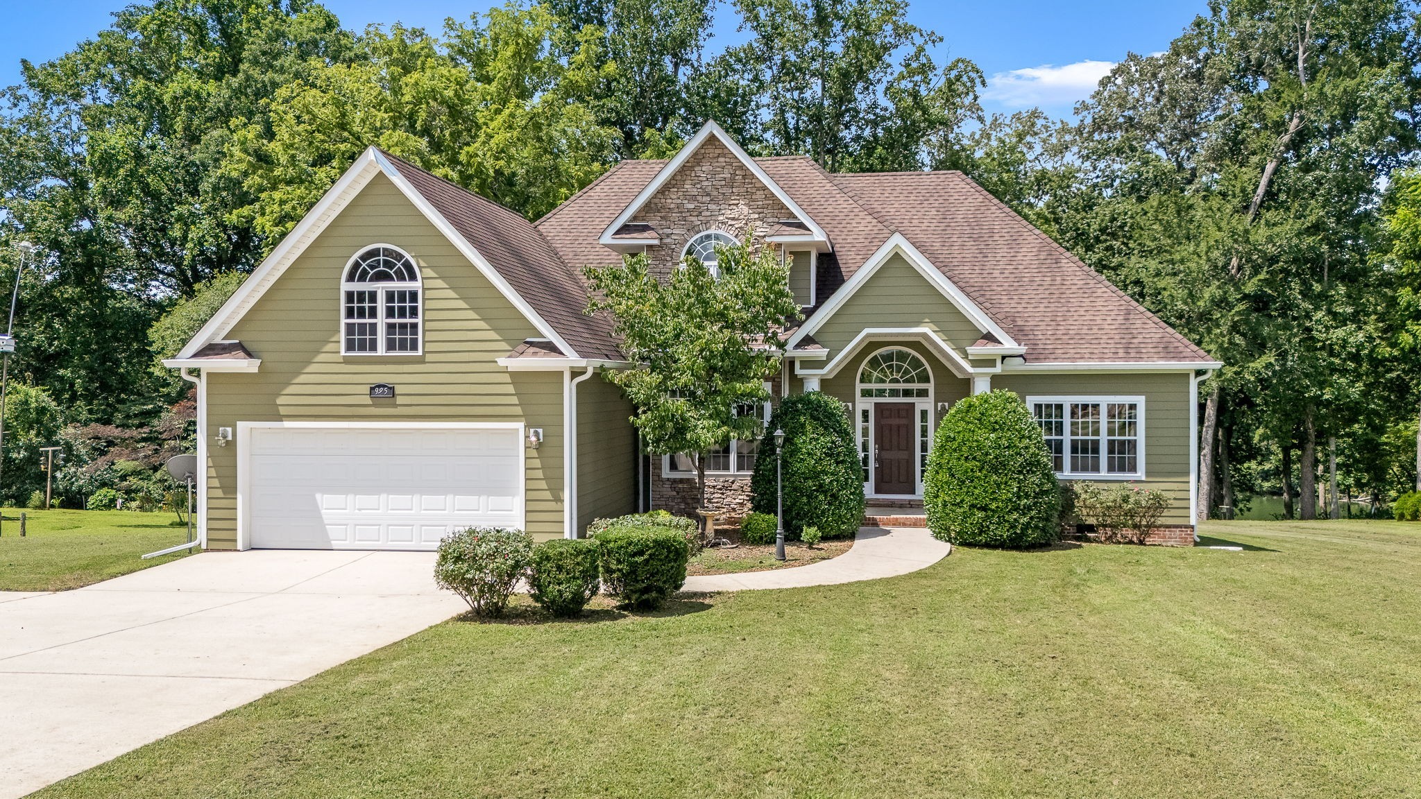 a front view of a house with garden