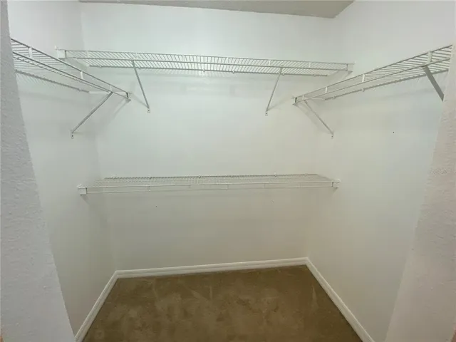 a view of a room with racks on the wall