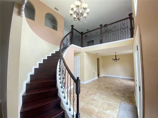 a view of a hallway with stairs