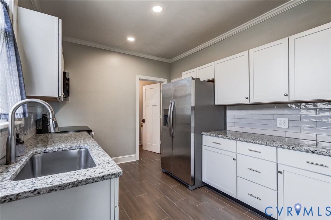 418 4th Street West Point, VA 23181 - Photo 13 of 36 a kitchen with stainless steel appliances granite countertop a refrigerator sink and cabinets