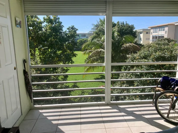 a view of outdoor space with deck and bench