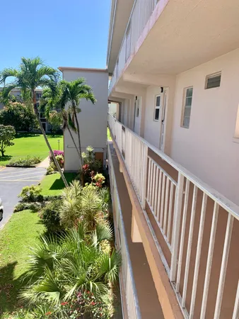 a backyard of a house with outdoor seating