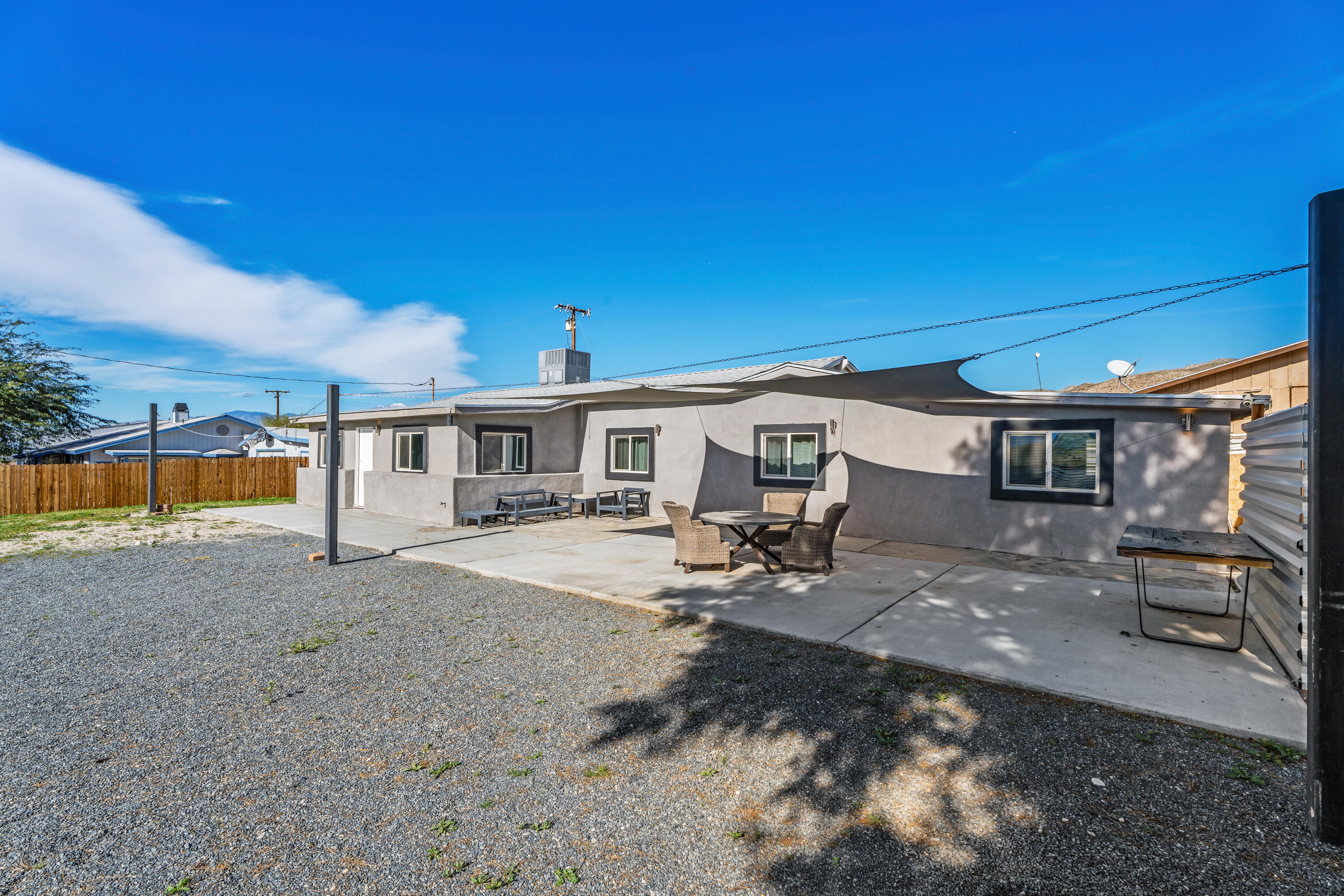 71362 Aurora Road Desert Hot Springs, CA 92241 - Photo 11 of 38 a view of a house with backyard patio and swimming pool