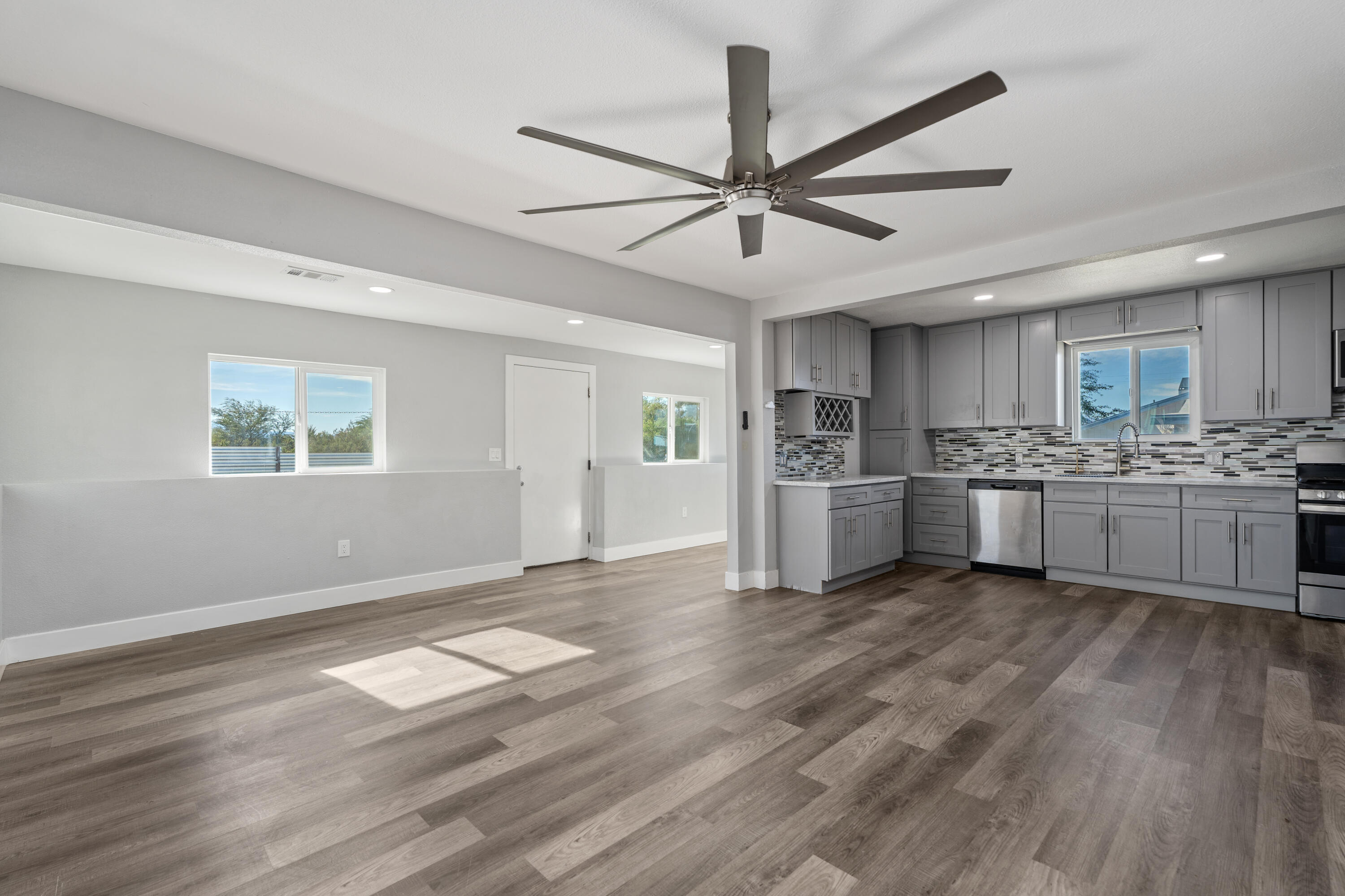 71362 Aurora Road Desert Hot Springs, CA 92241 - Photo 15 of 38 a view of a kitchen with a sink cabinets and wooden floor