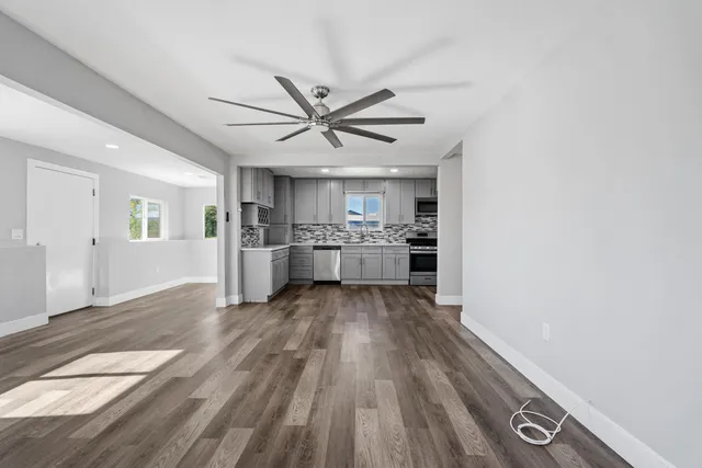 a view of kitchen with wooden floor and window