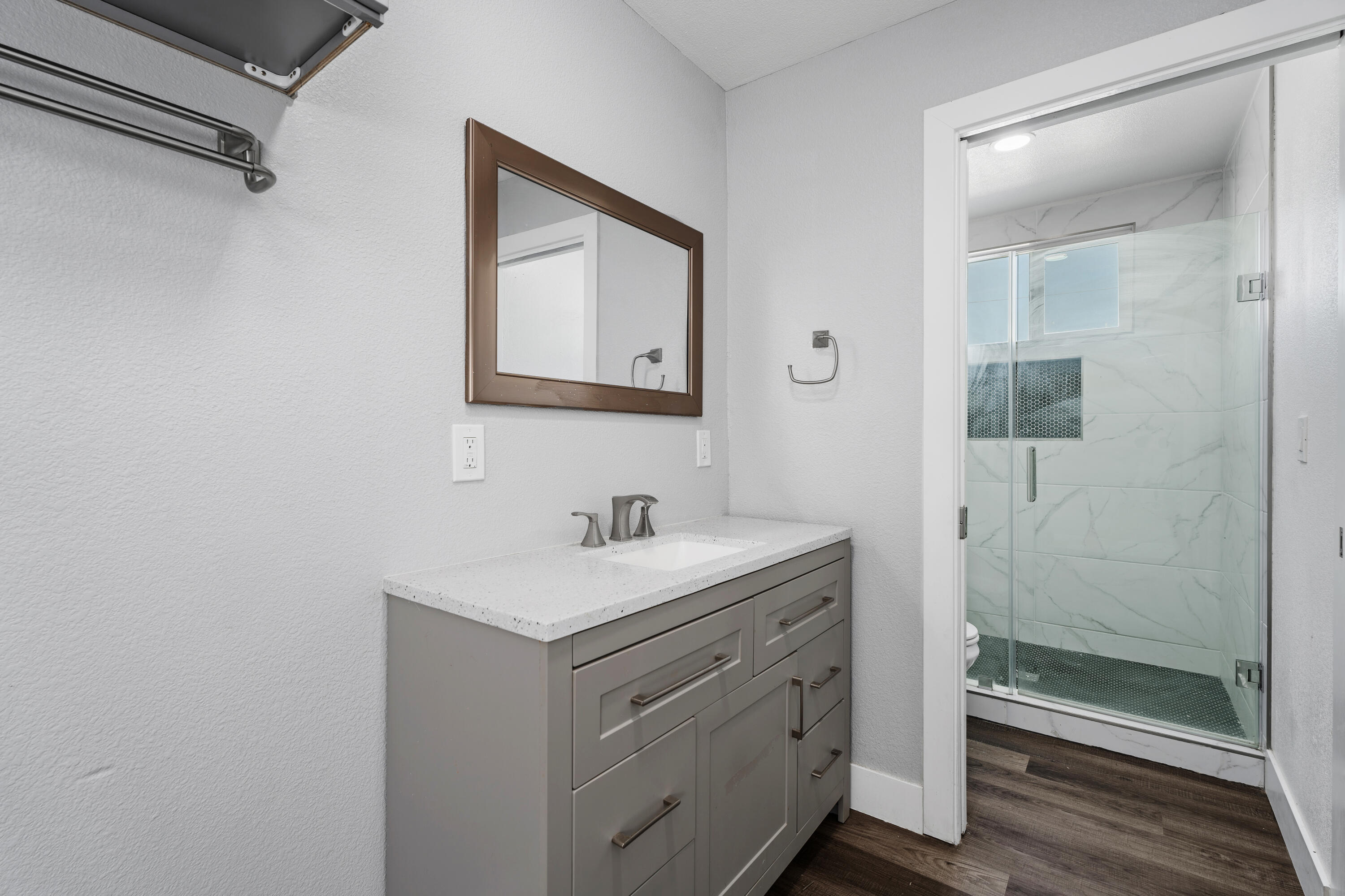71362 Aurora Road Desert Hot Springs, CA 92241 - Photo 26 of 38 a bathroom with a toilet a sink and mirror