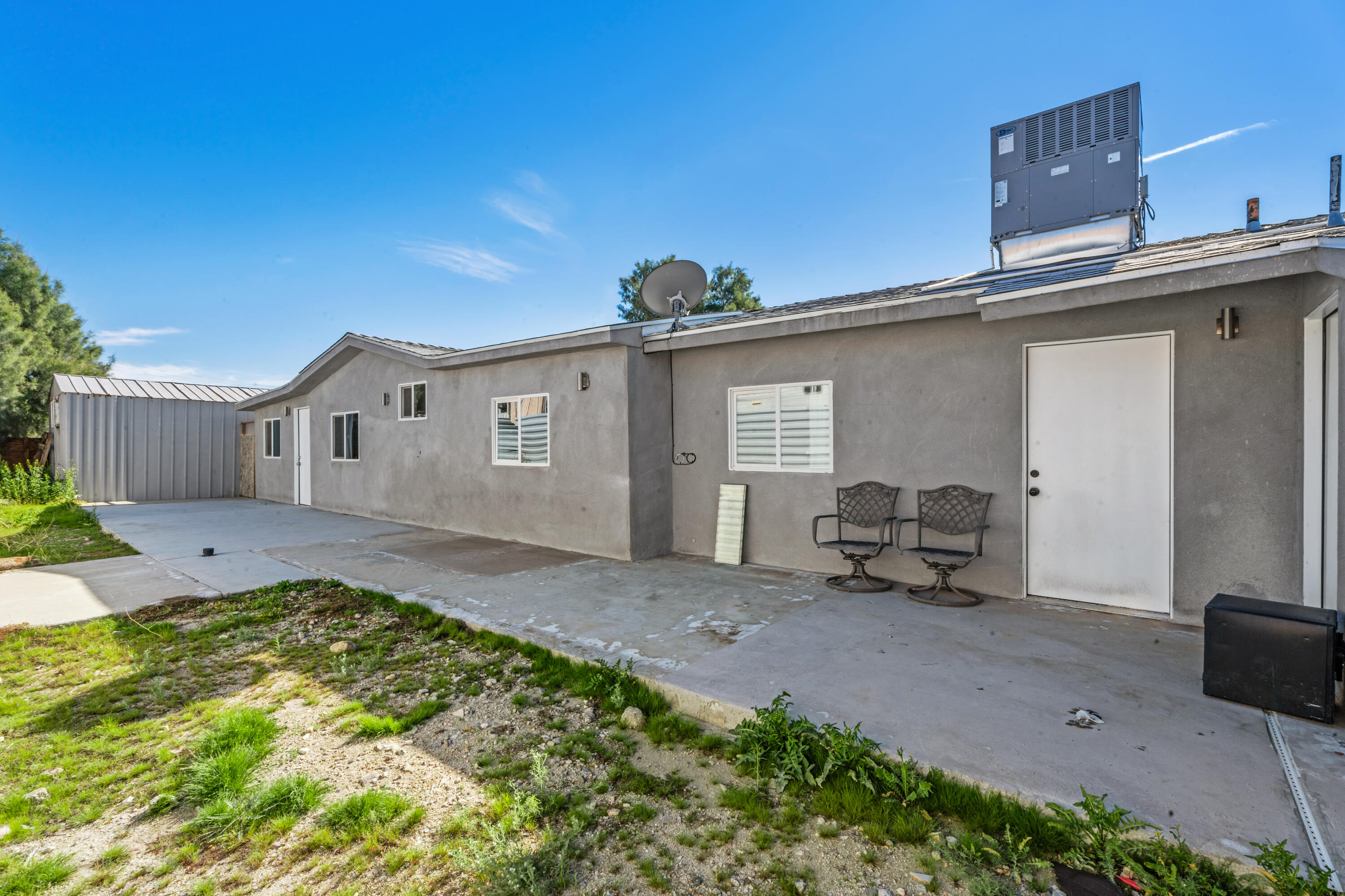 71362 Aurora Road Desert Hot Springs, CA 92241 - Photo 35 of 38 a view of a house with backyard and sitting area