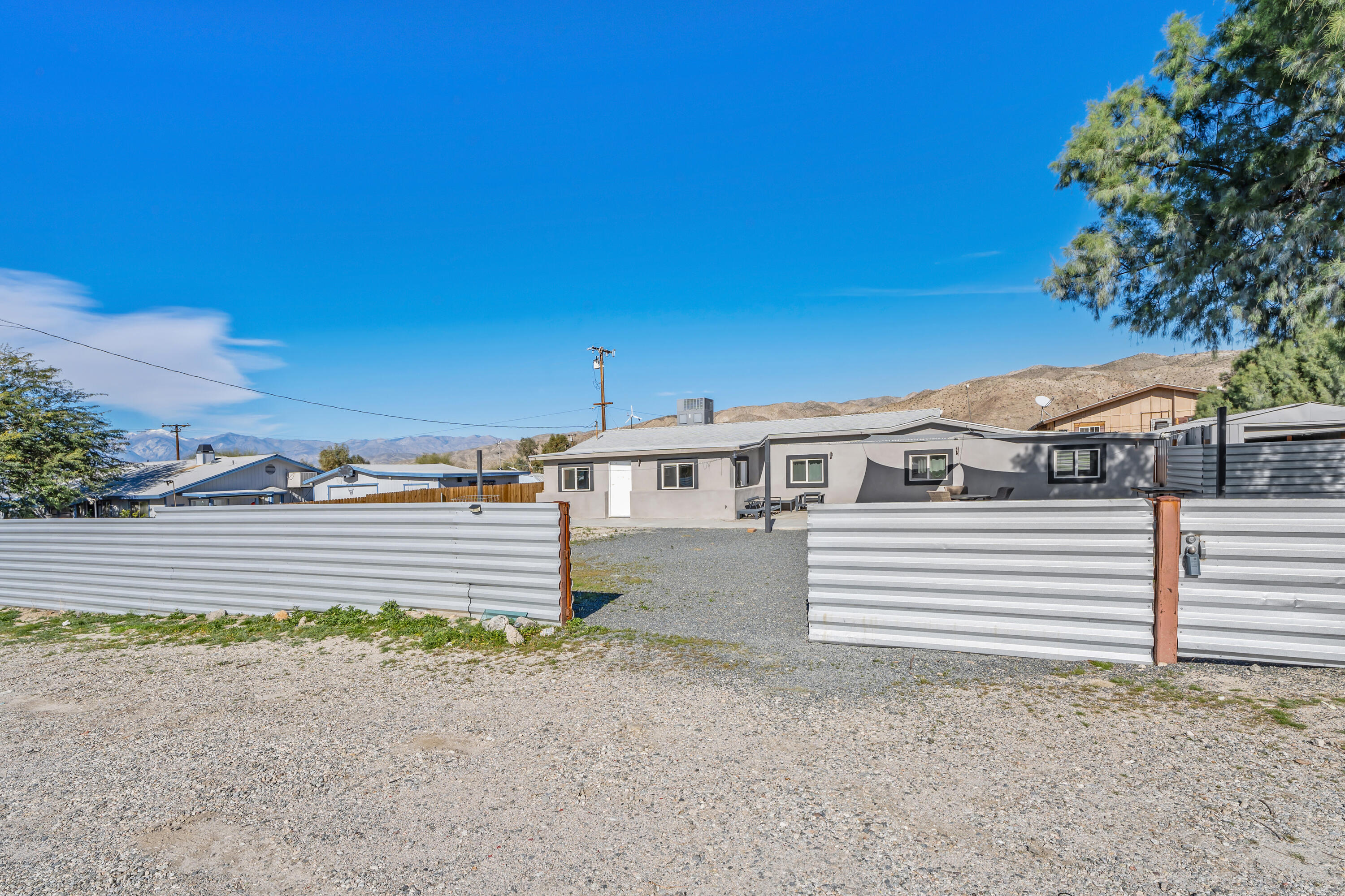 71362 Aurora Road Desert Hot Springs, CA 92241 - Photo 5 of 38 a view of a house with a yard
