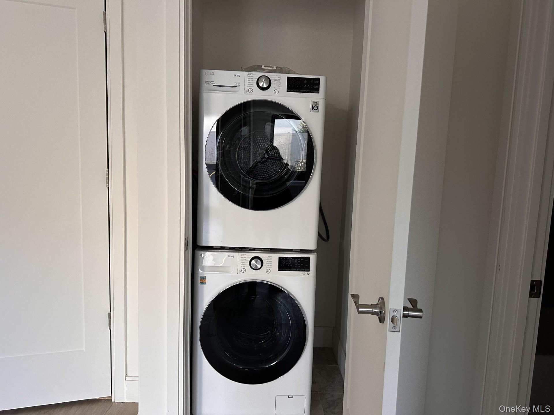 362 West Merrick Road, Unit 106 Valley Stream, NY 11580 - Photo 5 of 6 Laundry area featuring stacked washer / dryer