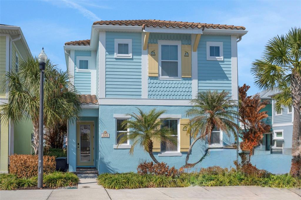 2968 Salted Rim Road Kissimmee, FL 34747 - Photo 1 of 86 a front view of yellow house with a small yard