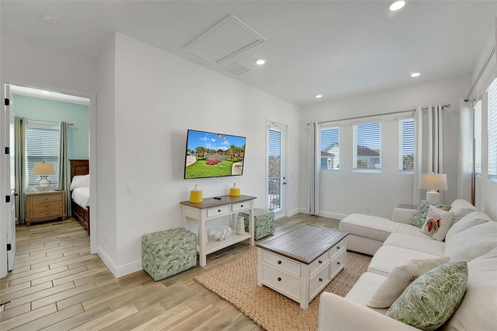 2968 Salted Rim Road Kissimmee, FL 34747 - Photo 18 of 86 a living room with furniture and a flat screen tv