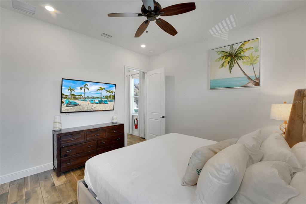 2968 Salted Rim Road Kissimmee, FL 34747 - Photo 22 of 86 a bedroom with a bed and a flat screen tv