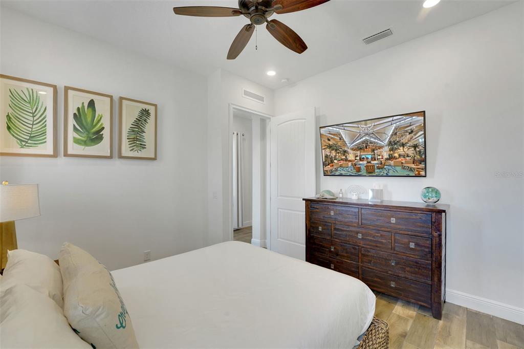 2968 Salted Rim Road Kissimmee, FL 34747 - Photo 25 of 86 a bedroom with a bed and a painting on the wall