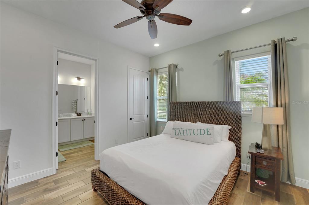 2968 Salted Rim Road Kissimmee, FL 34747 - Photo 27 of 86 a bedroom with a bed and a chandelier