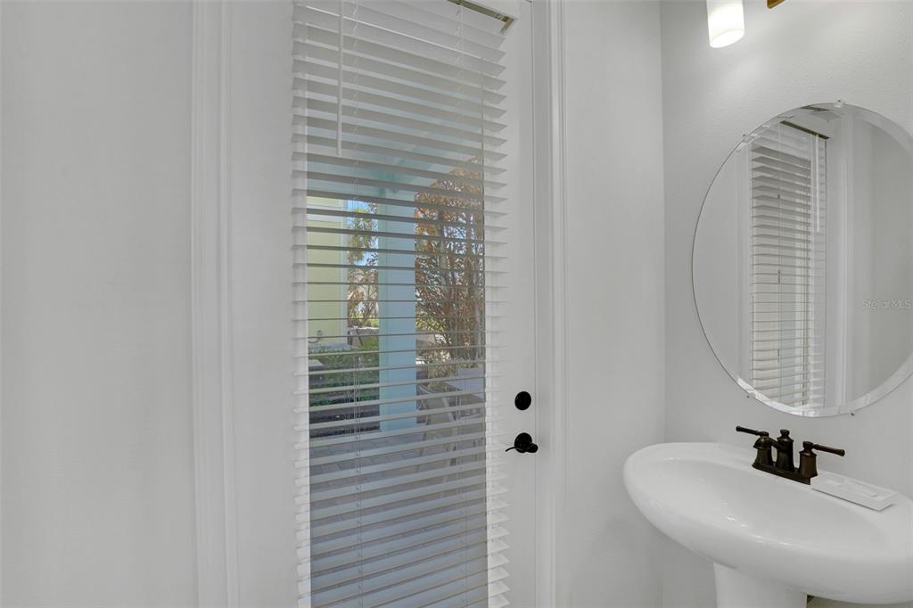 2968 Salted Rim Road Kissimmee, FL 34747 - Photo 28 of 86 a bathroom with a sink and a mirror