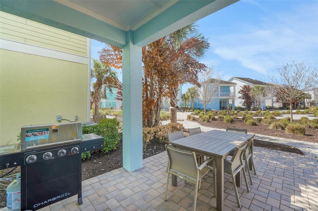 2968 Salted Rim Road Kissimmee, FL 34747 - Photo 30 of 86 a backyard of a house with table and chairs